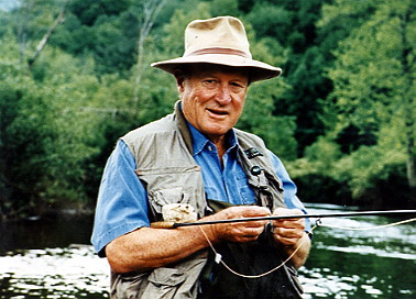 Leigh H. Perkins fly-fishing in his fishing vest